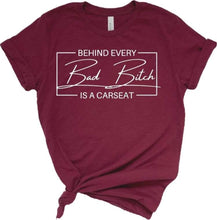 Load image into Gallery viewer, Behind every bad bitch is a carseat adult tee